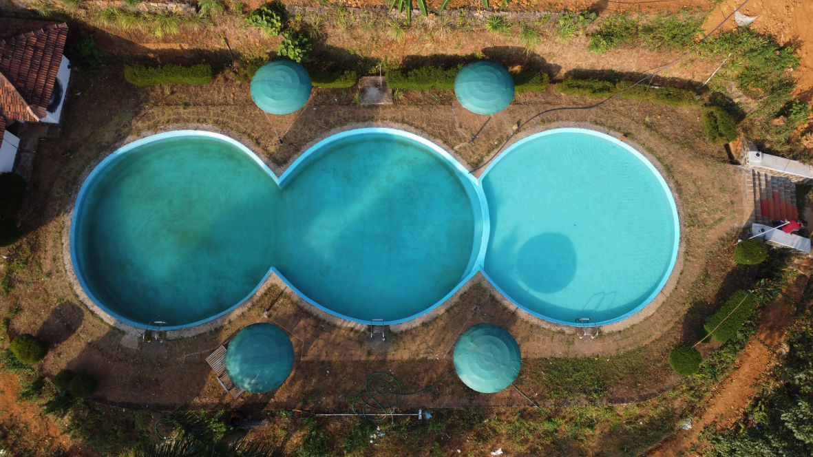 Natural spring-water swimming pool surrounded by forest