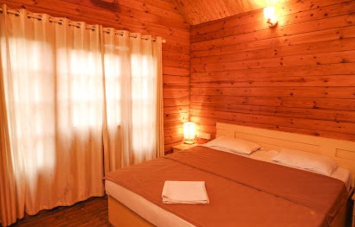Signature wooden villa interior with mountain views